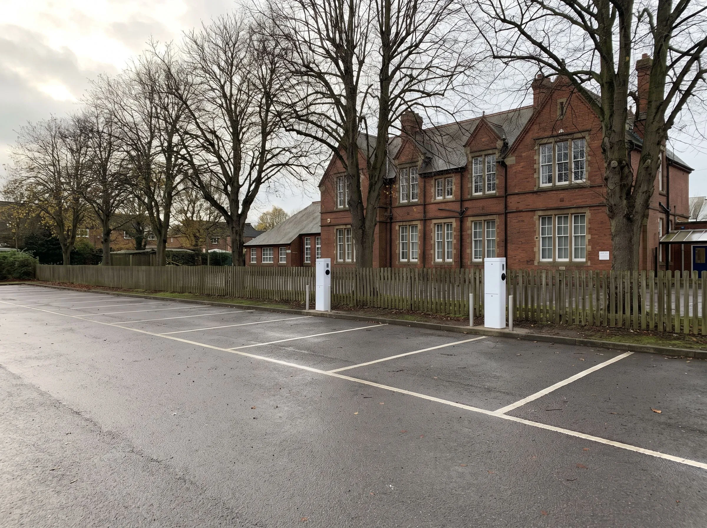 School EV charging installation with two charge points beside parking bays at a UK school